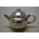 A Chinese silver miniature teapot & cover or water dropper, maker's mark, with ivory handle,