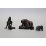 A Chinese carved soapstone pig, 10cm long,