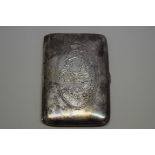 An Oriental silver cigarette case, stamped '90', engraved with a dragon to the top, 8.5 x 5.