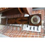 A 1930s walnut small longcase clock, striking on gongs, 13cm high.