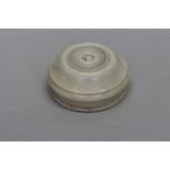 An early 19th century ivory cased drycard pocket compass, labelled 'Wm Harris & Co', 5.3cm diameter.