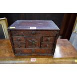 An 18th century carved oak mural cupboard or spice chest, dated 1751, 20.5cm high x 28cm wide.