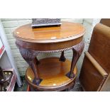 A pair of 1930s carved mahogany oval occasional tables, 64cm wide.