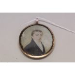 English School, circa 1800, bust length portrait miniature of a gentleman wearing a navy jacket,