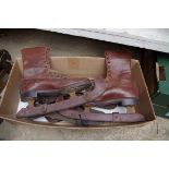 A pair of vintage brown leather ice skates; together with two further pairs of skate blades.