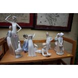 Eight Continental porcelain figures, to include four Lladro examples, largest 36.5cm high.