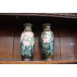 A pair of Royal Doulton stoneware vases, 29.5cm high.