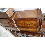 A reproduction mahogany and crossbanded serpentine fronted drinks cabinet, 72cm wide.