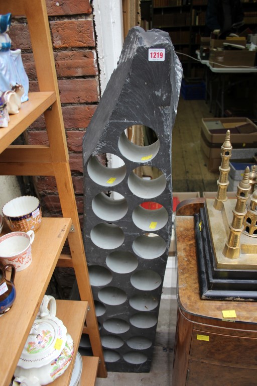 An unusual slate wine rack, with 22 bottle apertures, 123cm high.