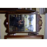 An antique mahogany and parcel gilt fret framed wall mirror, 65 x 41.5cm.