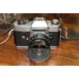 Cameras: a Leicaflex SL, chrome, No.1197481, with Summicron-R 1:2/50 lens, No.2666532.