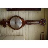 A Victorian rosewood and mother of pearl wheel barometer, 103cm high.