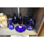 A small quantity of Bristol Blue glass, to include a pair of decanters and stoppers, 16cm high.