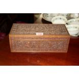 An Indian carved sandalwood casket, 28cm wide.