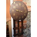 An oak wall clock.