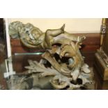 A pair of rococo style cast brass figural wall lights.