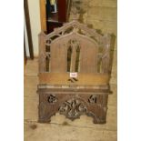 A Victorian carved oak folding bookstand, in the Gothic stand, 34cm wide.