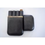 A vintage black leather and silver mounted four cigar case and cover.