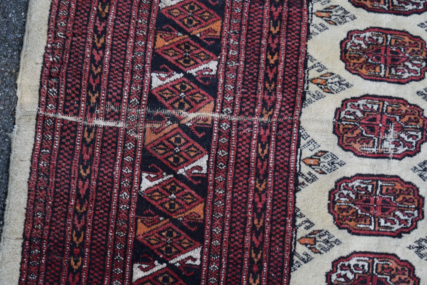 A Pakistan Bokhara carpet, with allover gul design on beige field, 268 x 186cm. - Image 2 of 4