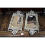 A pair of late 19th century cast brass framed wall mirrors, 56cm high.