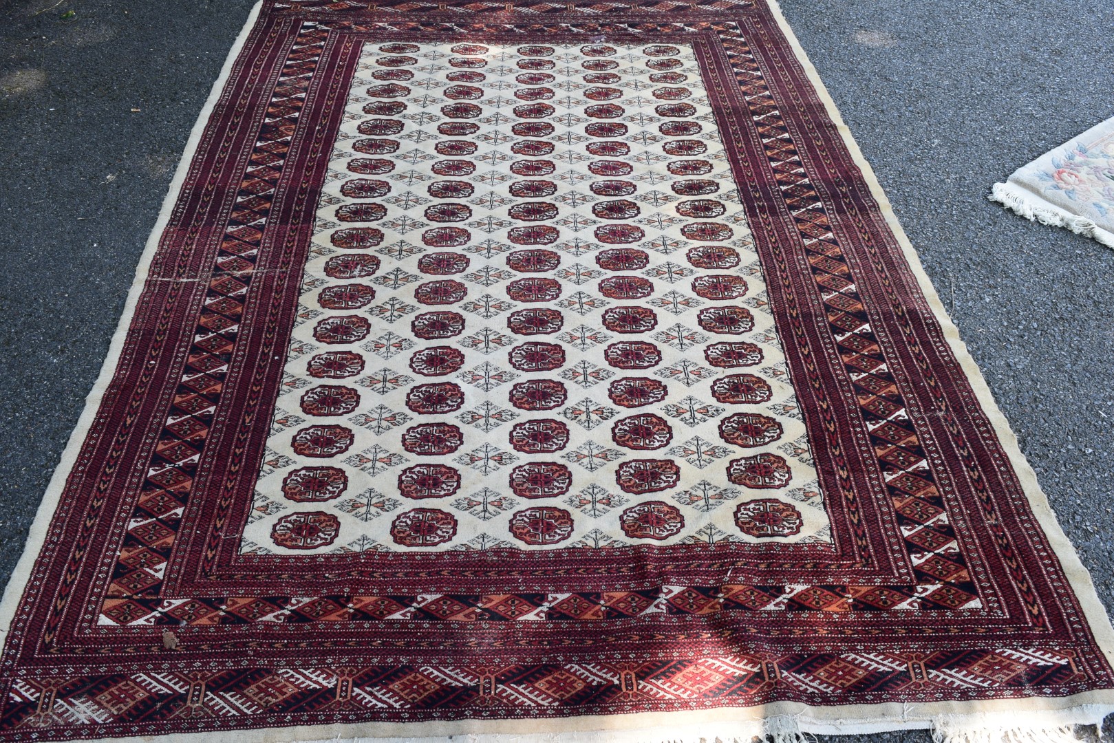 A Pakistan Bokhara carpet, with allover gul design on beige field, 268 x 186cm.