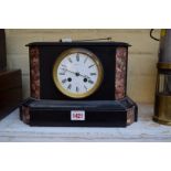 A late 19th century slate and red marble mantel clock, 29cm wide.