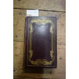 Books: a circa 1820 manuscript and illustrated small album, gilt edges, bound in red leather.