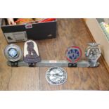 Five car radiator badges.