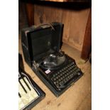 A Remington 'Home Portable' typewriter, in case.
