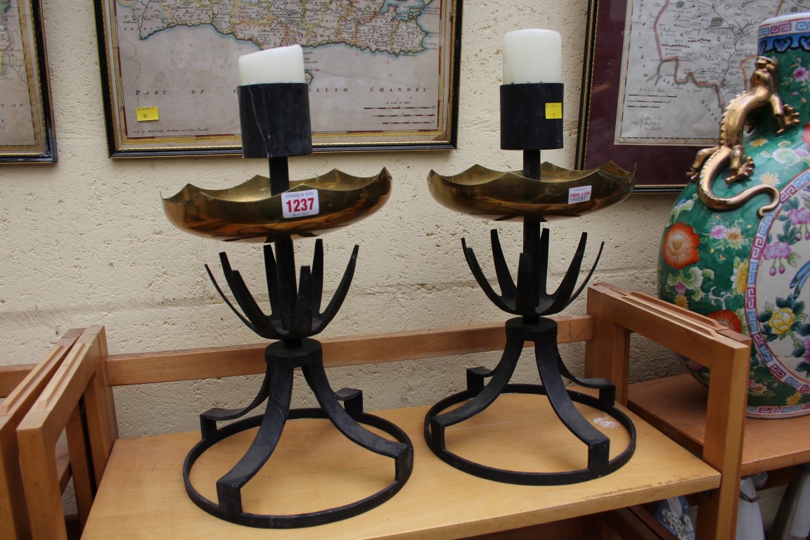 A pair of brass and black painted candlesticks, 41cm high.