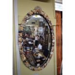 A shell framed oval mirror, 80 x 47.5cm.