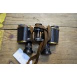 A pair of Tasco 10x50 binoculars, cased; together with a pair of Goerz 6x24 binoculars,