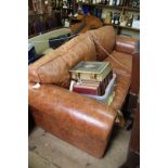 A large tan leather two seater sofa, approx 230cm wide.