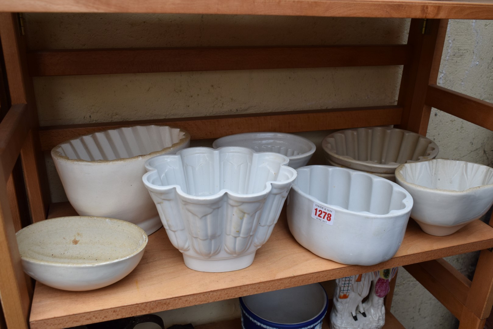Seven various pottery jelly moulds.