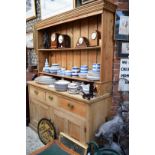 An antique pine dresser and rack, 161cm wide.