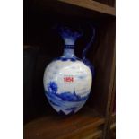 A blue and white porcelain ewer, painted with a landscape scene, 29.