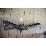 An antique Turkish flint lock 'knee-blunderbuss'.