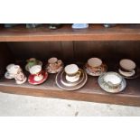 A collection of 19th century and later English pottery and porcelain tea cups and saucer,