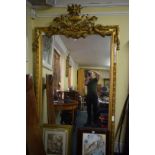 A large antique gilt wood and gilt gesso framed wall mirror, in the Louis XVI style, 225 x 127cm.