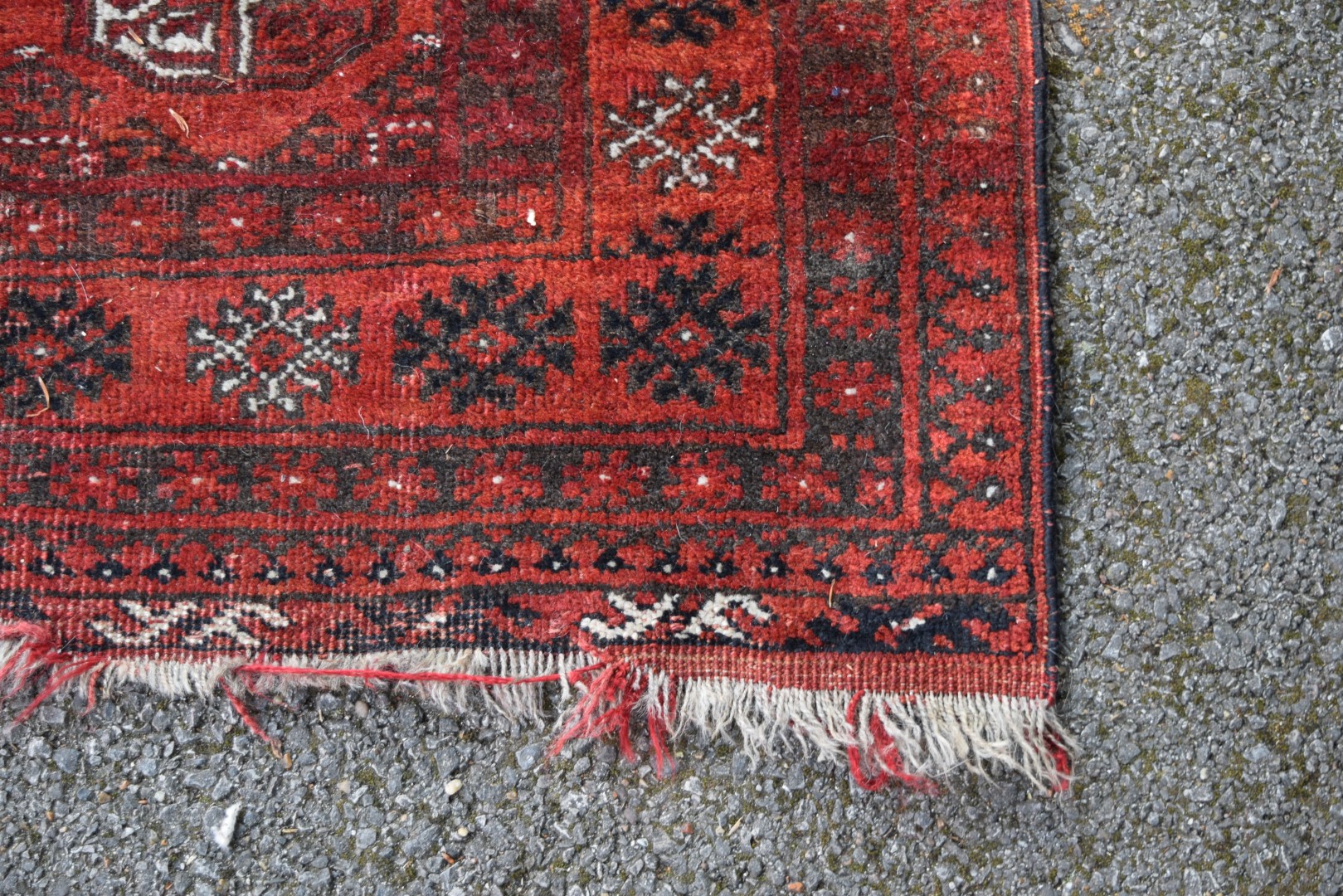 An Afghan rug, with gul design on a red field, 120 x 94cm. - Image 2 of 3