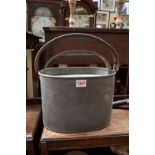 Angling: an old pewter live bait tin, with swing handles.