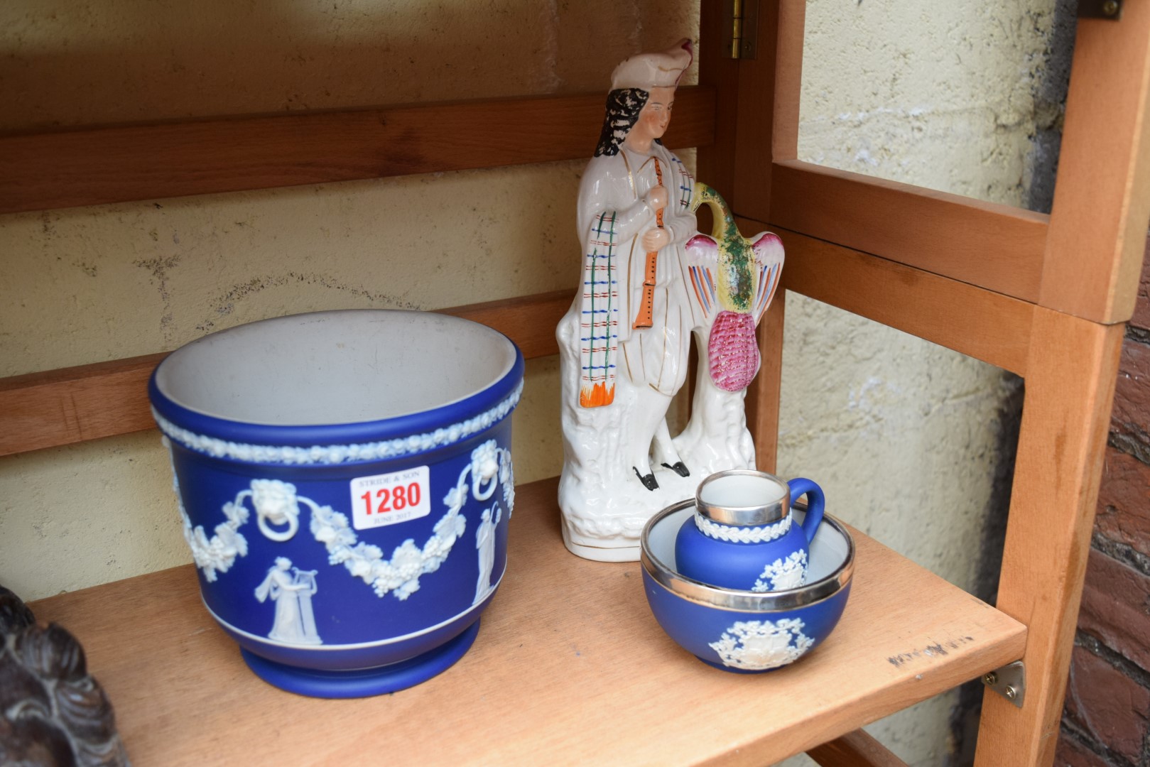 An Adams jasperware and silver mounted cream jug and sugar bowl;