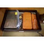 Tobacciana: two tan leather cigar cases; together with another tan leather cigarette case;