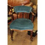 A Victorian mahogany and button upholstered desk chair.