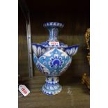 An Iznik style vase, 23.5cm high, (glaze chips).