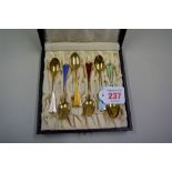 A cased set of Norwegian silver gilt and enamel coffee spoons. by David Andersen.