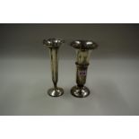 A silver trumpet vase, by H W Ltd, (weighted); and another silver trumpet flower vase,