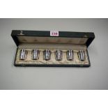 A cased set of German .800 silver tots.