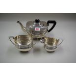 An Edwardian, Georgian style, silver three piece tea set, by Thomas Edward Atkins, Birmingham 1909,