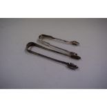 A pair of George III silver Old English pattern sugar tongs, by I B, London 1796; and another pair,